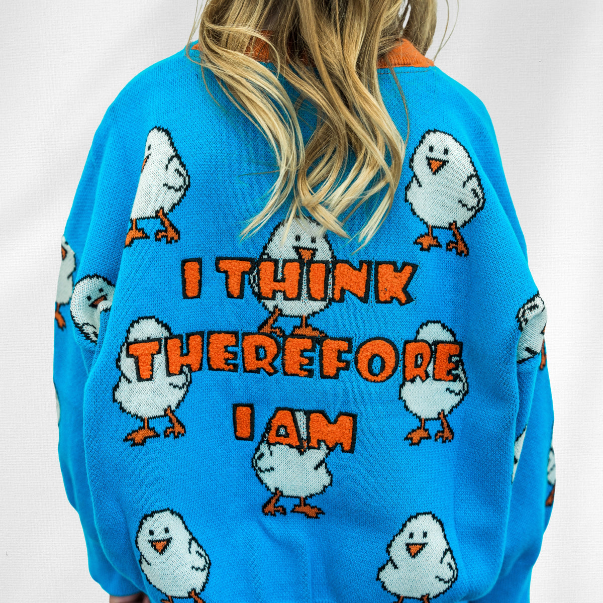 Chicklet Cardi back detail with chick motifs and orange I think therefore I am lettering