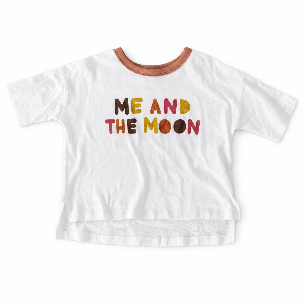 White Luna Tee with a brown neckline, colorful ME AND THE MOON lettering and a longer back hem.