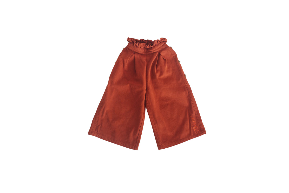 Rusty orange Easy Pant with a gathered waist, side buttons and wide cropped legs