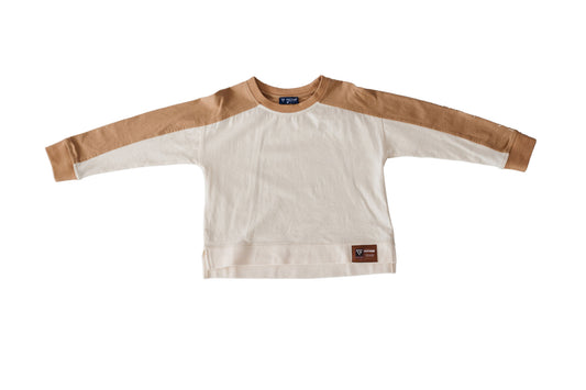 The Modern Rugby Tee is shown flat with camel sleeves, an ivory body and a brown patch near the hem.