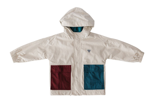 The cream Snow Day Unisex Jacket is shown flat with a hood and contrasting burgundy and teal front pockets.
