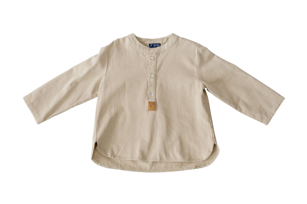 The ivory Urban Maverick Henley Tee is shown flat with a Henley-style button placket, brown accent and rounded hem.