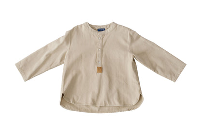 The ivory Urban Maverick Henley Tee is shown flat with a Henley-style button placket, brown accent and rounded hem.