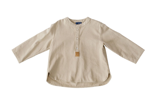The ivory Urban Maverick Tee is shown flat with a Henley-style button placket, brown accent and rounded hem.