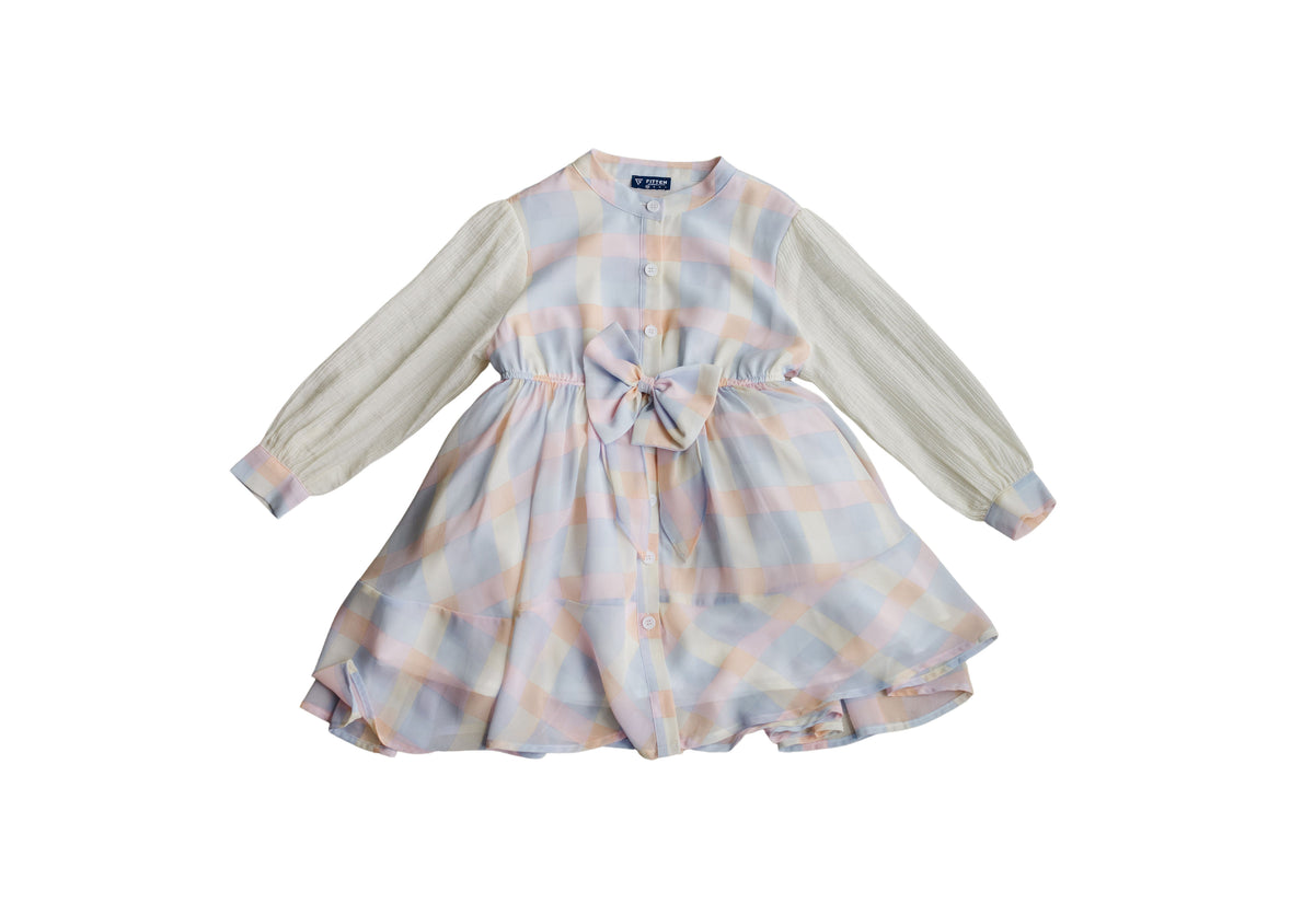 Twirl Me Dress front with pastel plaid, a waist bow, buttons and textured cream sleeves