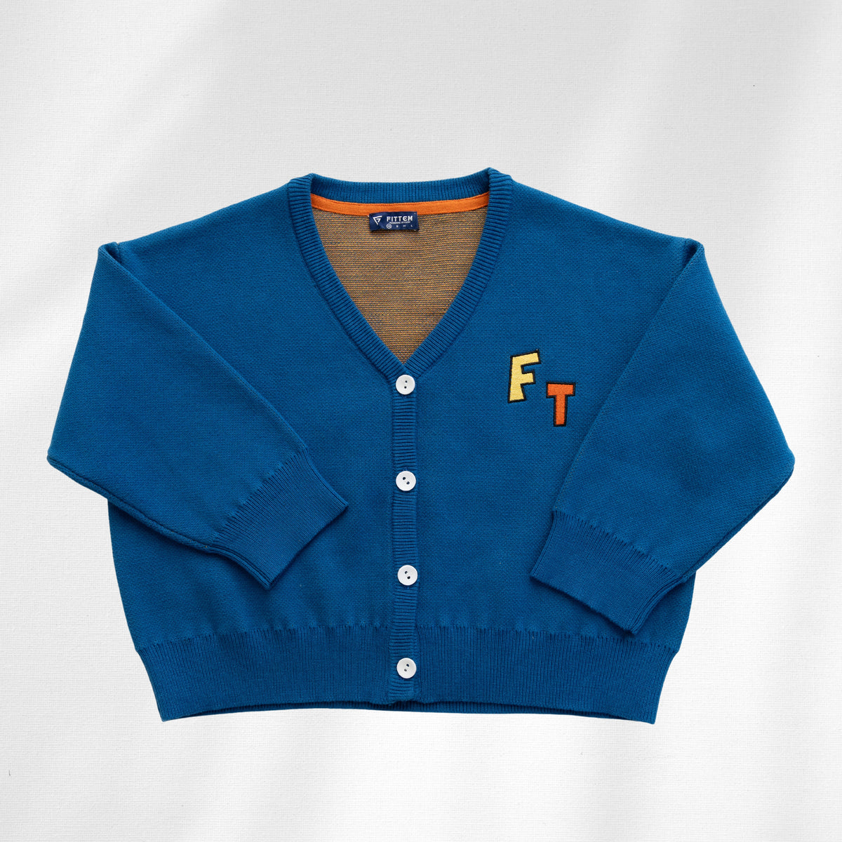 Blue Watch Me Grow Cardi front with white buttons and small FT lettering